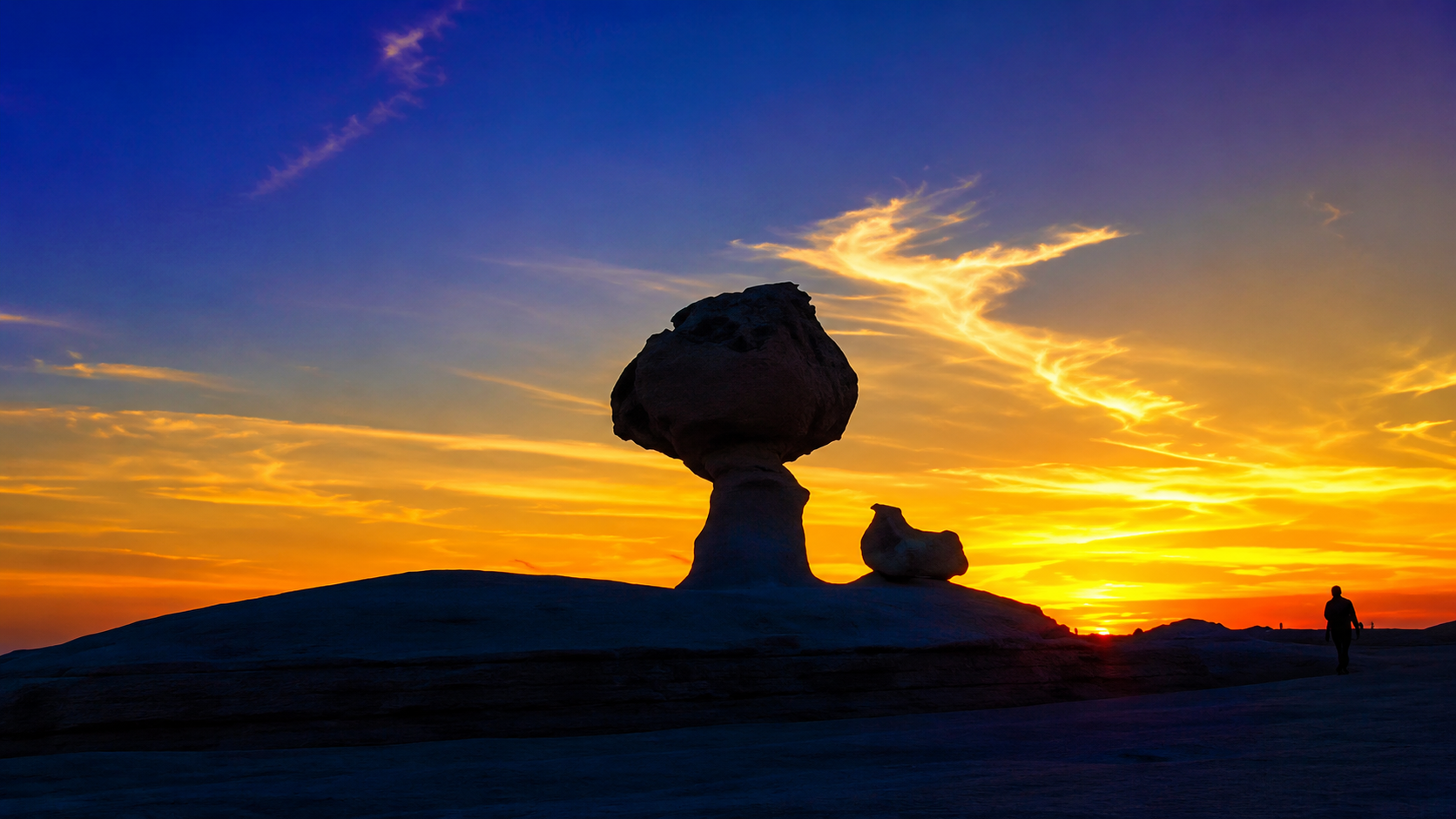 Mushroom-shaped White Desert rock at sunset