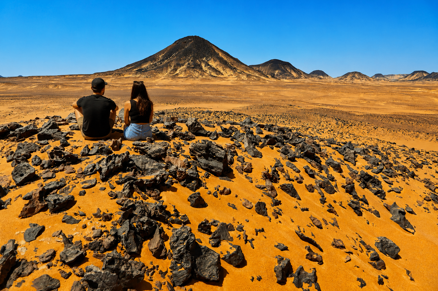 Black Desert volcanic mountain at sunset